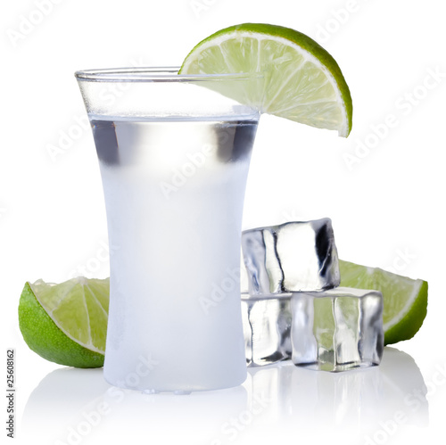 Photo: shot glass filled with clear cold alcohol shot glass filled with clear cold alcohol