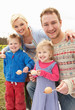 Family Having Egg And Spoon Race Family Having Egg And Spoon Race
