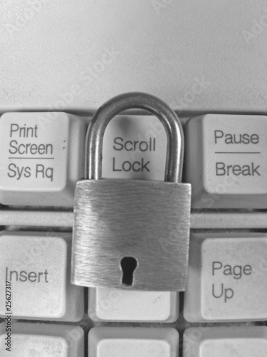 Photo: Padlock on a computer keyboard Padlock on a computer keyboard