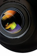 Lens with hood isolated on white