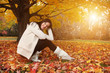 Portrait of beautiful young woman in autumn park. Copyspace. Portrait of beautiful young woman in autumn park. Copyspace.