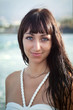 Portrait of young lady in the ocean waves
