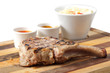 meat and sause on a cutting board meat and sause on a cutting board