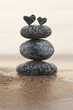 two stone hearts on a stone tower