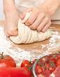 Photo: kneading dough on a wooden table kneading dough on a wooden table