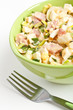 Egg salad in a green bowl with fork