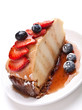slice of tasty cheesecake with syrop and berries