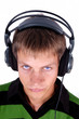 portrait of guy with headphones and strange color of eyes isolat