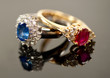 red and blue sapphire rings in diamond settings