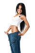 Young girl demonstrating weight loss Young girl demonstrating weight loss
