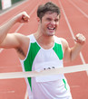 Exulting sprinter showing expression of victory in front of the