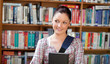 Joyful young caucasian woman holding a book Joyful young caucasian woman holding a book