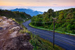 Curve road to the top of misty mountain