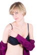 Sexy lifestyle picture - young blonde stripping