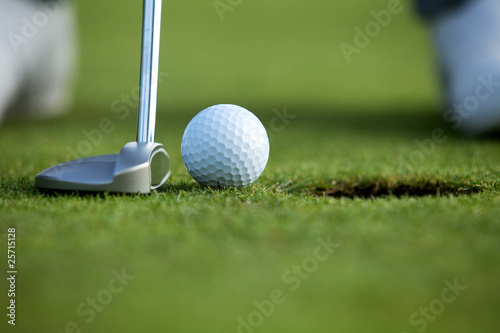 Photo: Person playing golf, low section Person playing golf, low section