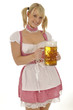 Junge Frau im Dirndl mit Maßkrug Bier Junge Frau im Dirndl mit Maßkrug Bier