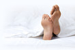 Photo: Person's foot in bed Person's foot in bed
