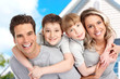 Young family near the new home.  Real estate concept.