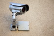 Silver modern security camera in the urban space