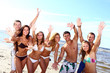 happy teenagers playing at the sea