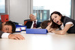 Young business team exchausted and over worked