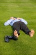 Businessman relaxing in park