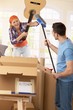 Couple pretending to fight at moving house