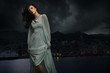Cute brunette over city background
