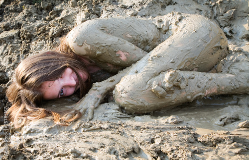 Photo: Naked girl lying in the dirt Naked girl lying in the dirt