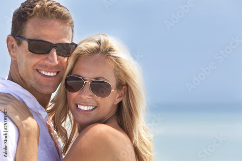 Photo: Attractive Man & Woman Couple Happy At the Beach Attractive Man & Woman Couple Happy At the Beach