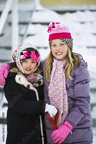 Photo: Portrait Of Two Girls In Winter Clothes Portrait Of Two Girls In Winter Clothes