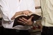 Man Showing Something In A Book