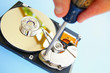 pc technician repairing a computer hardrive
