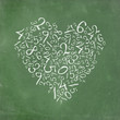 Heart shaped simple numbers on school-board. Heart shaped simple numbers on school-board.