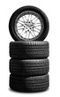 Set of summer tyres in front of white fond