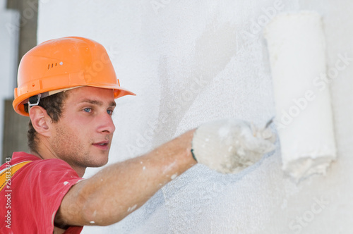 Photo: builder facade painter at work builder facade painter at work