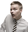 Man in shirt and tie making funny expression. Isolated on white.