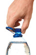 hand unscrew the cork on a bottle of water