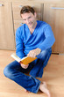 Young man is reading a book