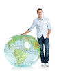 Handsome young boy standing by a globe on white