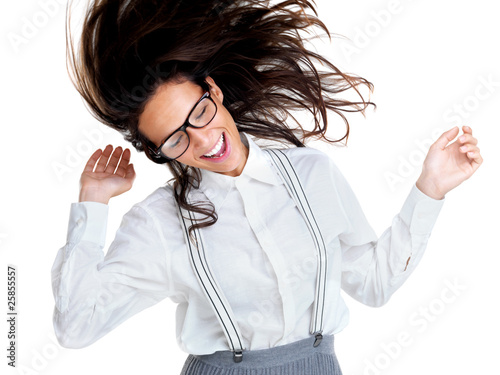 Photo: Young brunette woman dancing against white background Young brunette woman dancing against white background