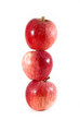 Three apples stacked on each other on an isolated background