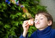 Photo: Boy Playing With Bubbles Boy Playing With Bubbles