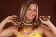woman holding a snake woman holding a snake