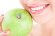 healthy teeth and green apple