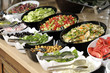 Buffet style food in trays Buffet style food in trays