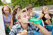 Teens eating sandwiches