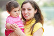 Smiling mother with child closeup