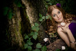 redhaired girl in wood