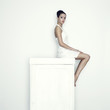 Girl sitting on the wardrobe